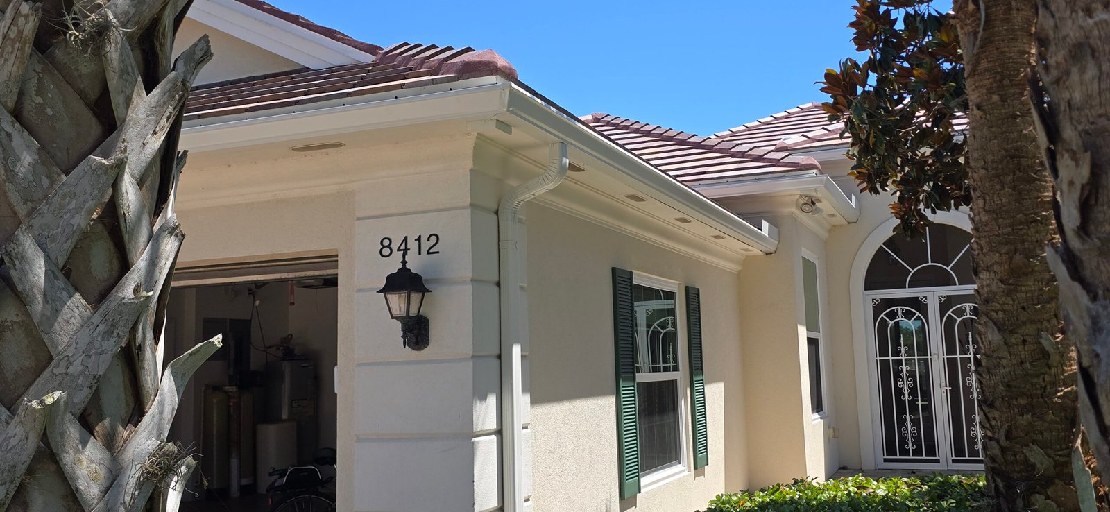 Close-up of seamless gutter section being repaired by Signature Gutters in Naples FL